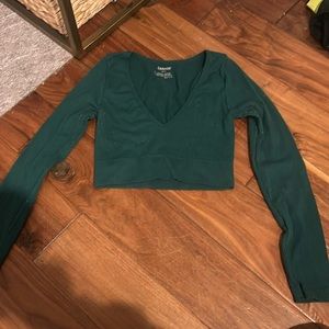 Emerald green long sleeve, v-necked shirt from garage slightly worn.